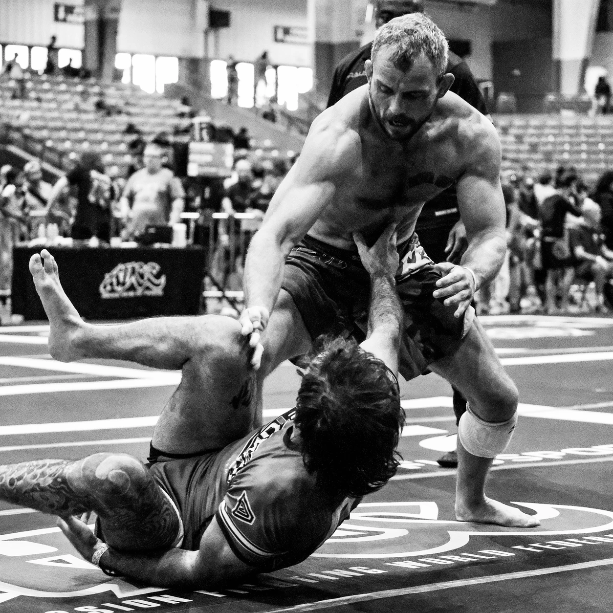 Grappler driving forward on a downed opponent at the ADCC Nashville Open