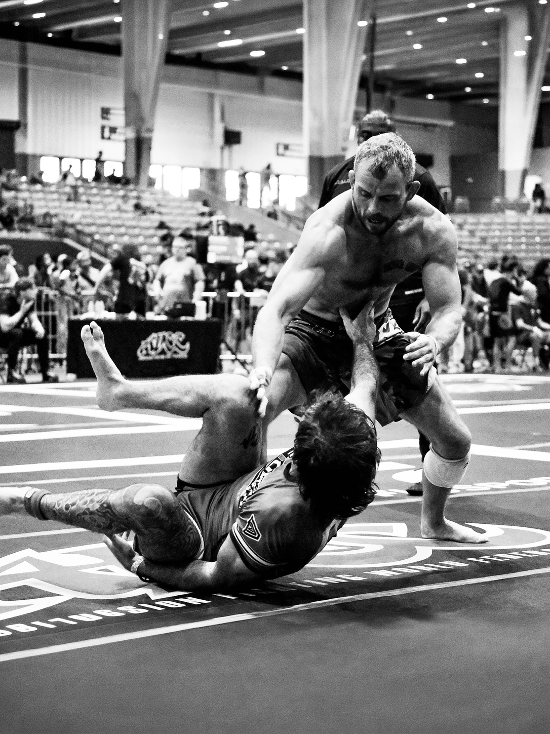 Grappler driving forward on a downed opponent at the ADCC Nashville Open